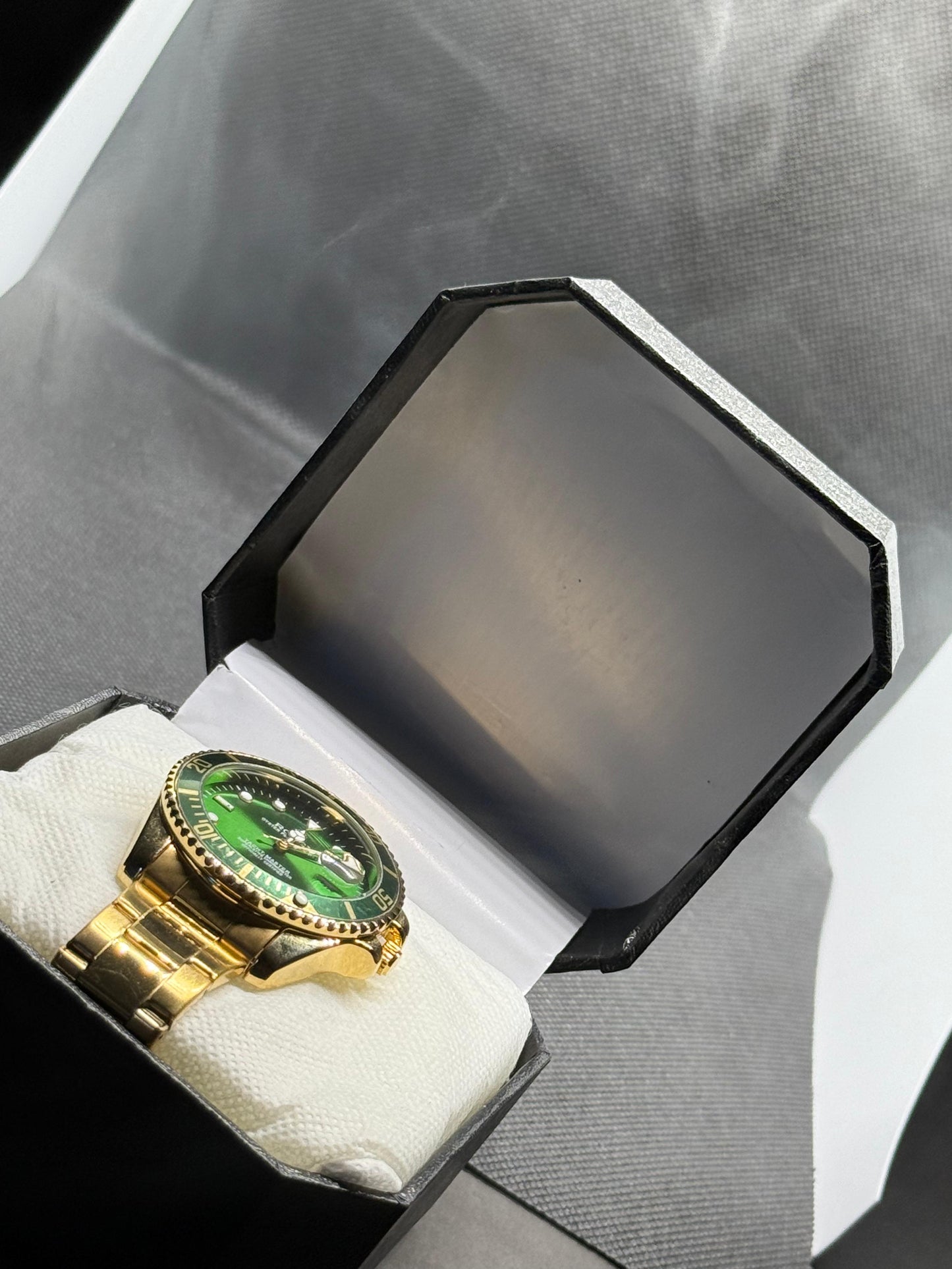 Rolex GMT Master II Gold & Green Luxury Watch in rotating dial